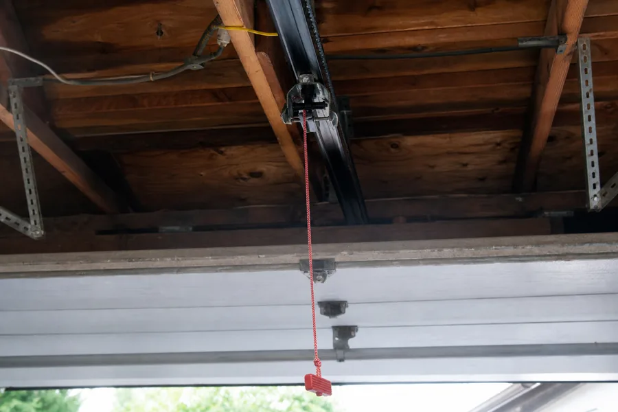 Emergency release cord on a garage door opener in Georgetown, TX